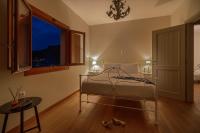 Posteľ alebo postele v izbe v ubytovaní SUN VILLA GLYFADA