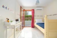 Posteľ alebo postele v izbe v ubytovaní SUN VILLA GLYFADA