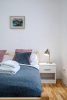Posteľ alebo postele v izbe v ubytovaní APARTAMENT RODZINNY