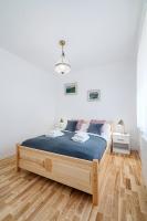 Posteľ alebo postele v izbe v ubytovaní APARTAMENT RODZINNY