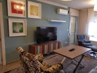 TV a/nebo společenská místnost v ubytování Apartamento Cream MRZ Rentals
