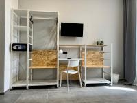 Televízia a/alebo spoločenská miestnosť v ubytovaní Residence Hotel Moderno