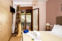 Posteľ alebo postele v izbe v ubytovaní Villas Roumeli