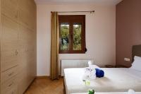 Posteľ alebo postele v izbe v ubytovaní Villas Roumeli