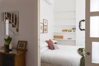 A bed or beds in a room at Amazing penthouse with terrace and rooftop in Trastevere