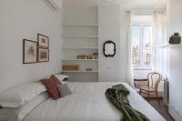 A bed or beds in a room at Amazing penthouse with terrace and rooftop in Trastevere