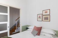 A bed or beds in a room at Amazing penthouse with terrace and rooftop in Trastevere