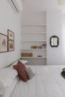 A bed or beds in a room at Amazing penthouse with terrace and rooftop in Trastevere
