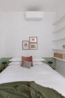 A bed or beds in a room at Amazing penthouse with terrace and rooftop in Trastevere