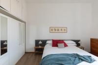 A bed or beds in a room at Amazing penthouse with terrace and rooftop in Trastevere