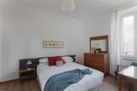 A bed or beds in a room at Amazing penthouse with terrace and rooftop in Trastevere