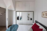 A bed or beds in a room at Amazing penthouse with terrace and rooftop in Trastevere