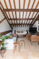 A television and/or entertainment centre at Amazing penthouse with terrace and rooftop in Trastevere