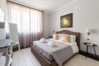 A bed or beds in a room at SuityRHome Campo de' Fiori