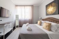 A bed or beds in a room at SuityRHome Campo de' Fiori