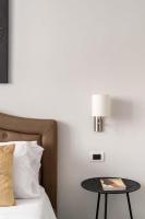 A bed or beds in a room at SuityRHome Campo de' Fiori