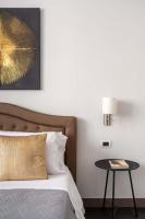 A bed or beds in a room at SuityRHome Campo de' Fiori
