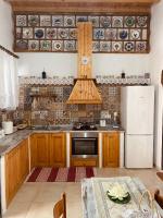 Kuchyň nebo kuchyňský kout v ubytování Archangelos Family House