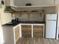 Kuchyň nebo kuchyňský kout v ubytování Enigma Suites