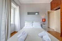 Postel nebo postele na pokoji v ubytování Mitropoleos Suite