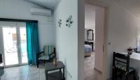 A bed or beds in a room at Ionion Apartments