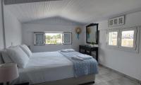 A bed or beds in a room at Ionion Apartments