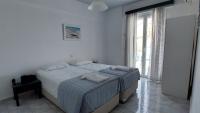 A bed or beds in a room at Ionion Apartments