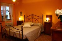 Łóżko lub łóżka w pokoju w obiekcie B&B La Torre a Revere