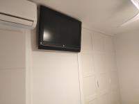 A television and/or entertainment centre at BEACHFRONT -- NEW LUXURY Apartment -- 1ª Linea Playa -- Fuengirola CITY CENTER -- Private PARKING -- Panoramic Sea Views --