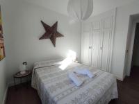 Postel nebo postele na pokoji v ubytování ATALAYA SUNSET terrazza panoramica privata con vista al mare