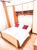 Posteľ alebo postele v izbe v ubytovaní Apartmani Ankica