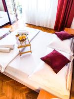 Posteľ alebo postele v izbe v ubytovaní Apartmani Ankica