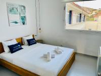 Postel nebo postele na pokoji v ubytování La Marina SeaView Penthouse