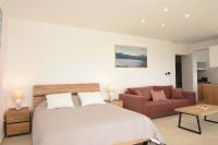 A bed or beds in a room at Villa Dafni - Infinite Sea Vistas with Private Pool