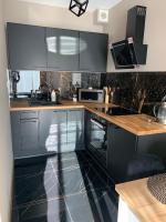 Kuchyňa alebo kuchynka v ubytovaní Apartamenty Danka