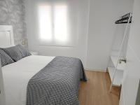A bed or beds in a room at Second Home Arzúa apartamentos