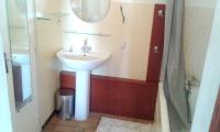 a bathroom with a sink and a mirror and a shower at Appartement d&#39;une chambre avec vue sur la mer jardin amenage et wifi a Hyeres a 2 km de la plage in Hyères
