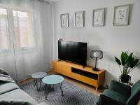 A television and/or entertainment centre at Second Home Arzúa apartamentos