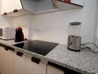 Kuchyň nebo kuchyňský kout v ubytování Apartment Osuna by Interhome