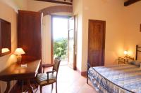 Posteľ alebo postele v izbe v ubytovaní Agriturismo Il Poggetto