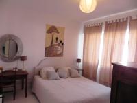 a bedroom with a white bed and a mirror at Appartement de 3 chambres a Les Sables d&#39;Olonne a 800 m de la plage avec wifi in Les Sables-d&#39;Olonne