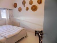 a bedroom with a bed and wooden plates on the wall at Appartement de 3 chambres a Les Sables d&#39;Olonne a 800 m de la plage avec wifi in Les Sables-d&#39;Olonne