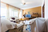 Televízia a/alebo spoločenská miestnosť v ubytovaní Oleander Apartment