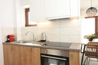 A kitchen or kitchenette at Villa Dafni - Infinite Sea Vistas with Private Pool