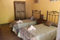 A bed or beds in a room at Turismo Rural Casa Sastre