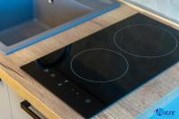 a stove top oven sitting on top of a counter at MODERN apartments WAVE near the AIRPORT in Velika Gorica