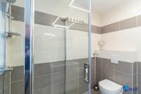 a bathroom with a shower and a toilet at MODERN apartments WAVE near the AIRPORT in Velika Gorica