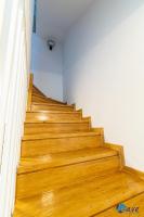 a set of wooden stairs in a room at MODERN apartments WAVE near the AIRPORT in Velika Gorica