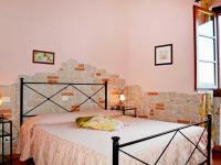 Posteľ alebo postele v izbe v ubytovaní Agriturismo Il Poggetto