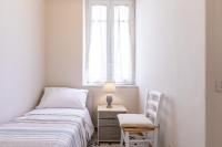 A bed or beds in a room at Stazione Notarbartolo Bright & Cozy Apartment